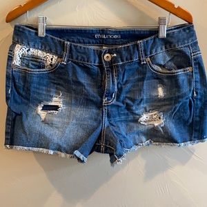 Denim shorts with lace accent